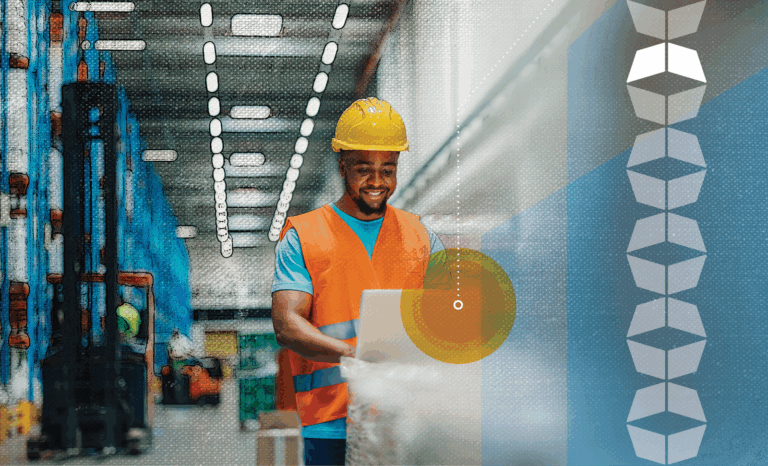 Man in warehouse smiling, representing how a modern warehouse management system (WMS) drives efficient operations and smoother supply chain management