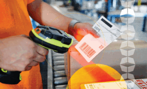 Warehouse worker scanning label for outgoing product, representing the importance of inventory accuracy