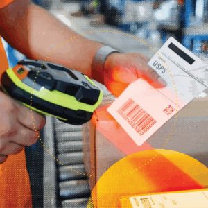 Warehouse worker scanning label for outgoing product, representing the importance of inventory accuracy