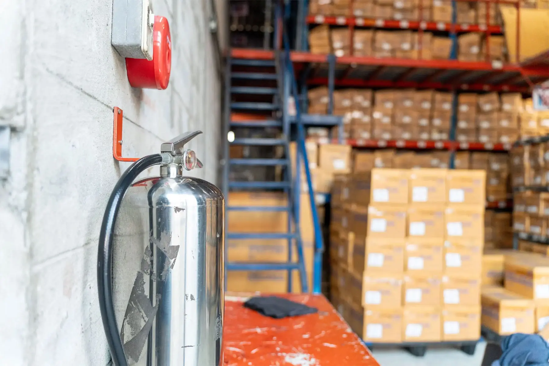 Fire extinguisher in warehouse setting