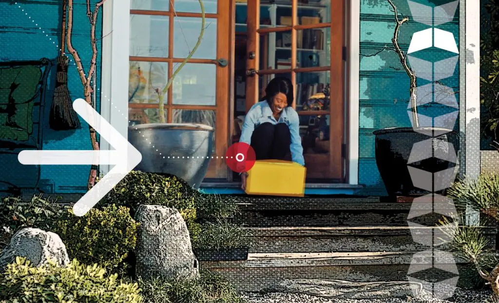 woman picking up an order fulfillment package on her front porch