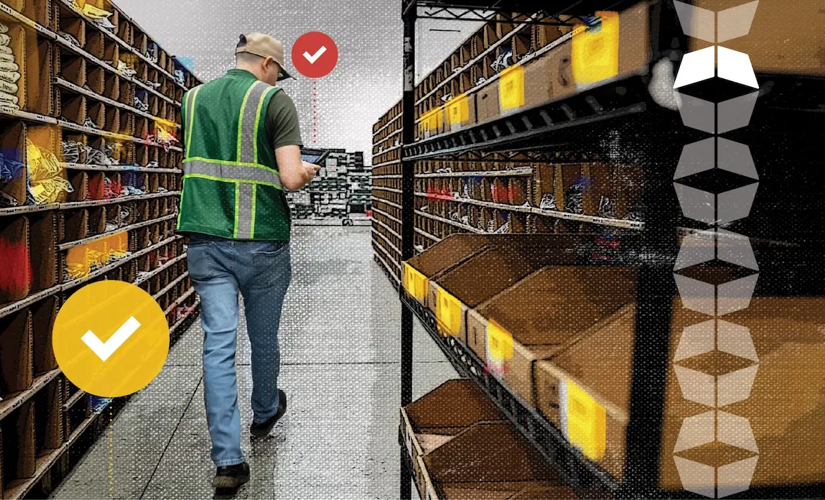 customer support warehouse associate walking down an aisle of ecommerce product