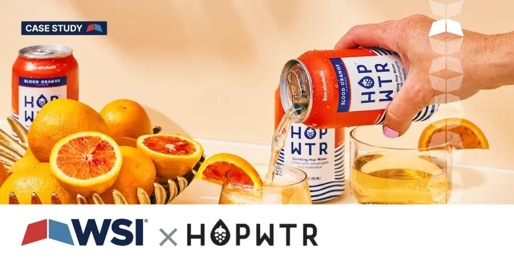 hopwtr alcohol alternative beverage being poured into a cup with 'WSI X HOPWTR' on a banner