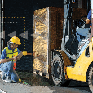 warehouse worker on dock next to loader and boxes, representing using warehouse slotting strategies to optimize order fulfillment