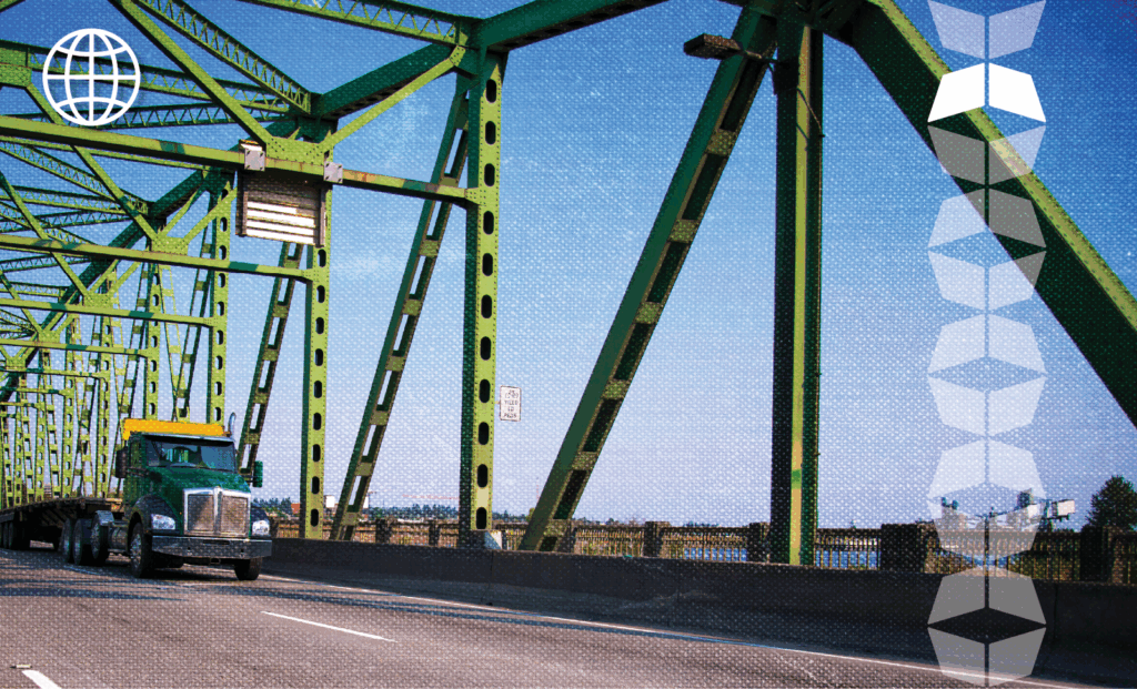 Truck on bridge representing the transportation signals that will change freight in 2026