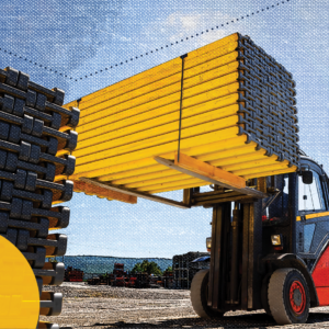 Building materials being handled by forklift, representing the importance of construction logistics.