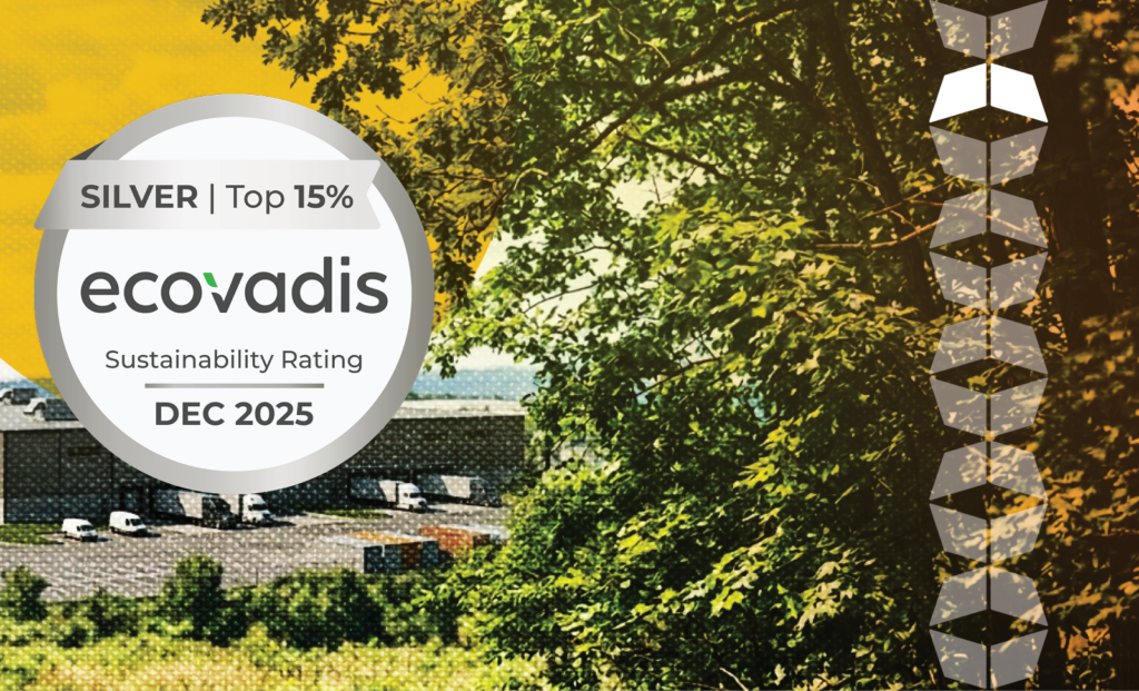 Image of green tree near warehouse, representing the EcoVadis sustainability rating and its importance in the supply chain