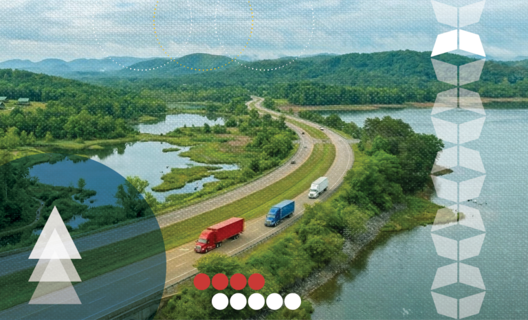 Trucks driving through lush landscape, representing the supply chain's affect and ESG goals in logistics