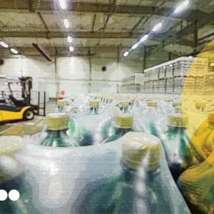 Warehouse with packaged bottles, representing downstream logistics and the end-to-end journey from production to distribution.