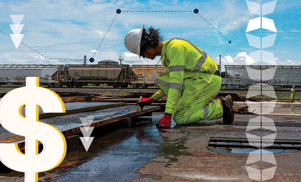 Image of worker writing next to train, representing the strategies that reduce rail demurrage.