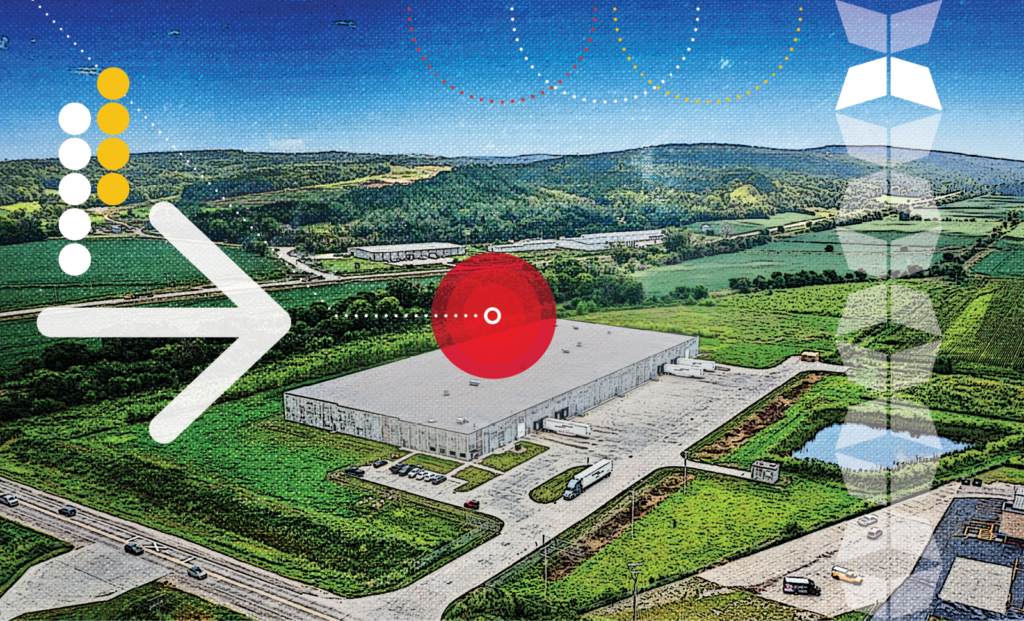 Aerial view of an industrial warehouse with a location marker, illustrating facility placement in distributed manufacturing warehousing.