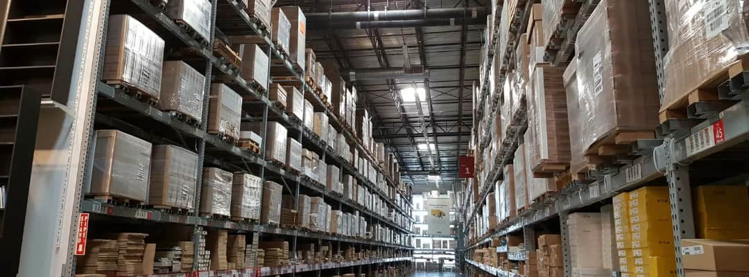 warehouse shelves with stacked pallets