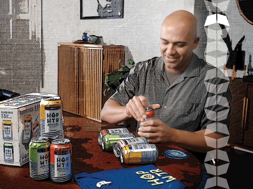 man opening a can of hopwtr