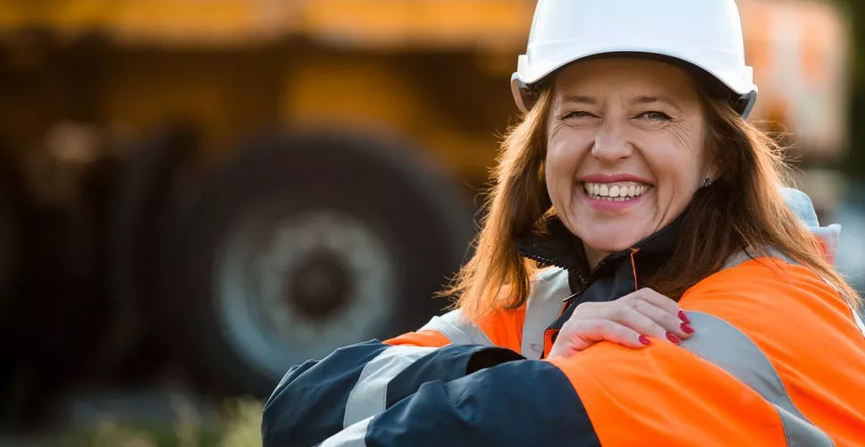 Warehouse specialist smiles