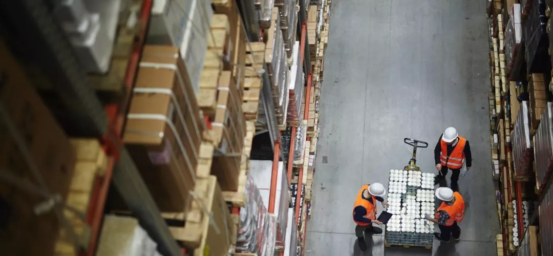 Warehouse workers managing orders in fulfillment center