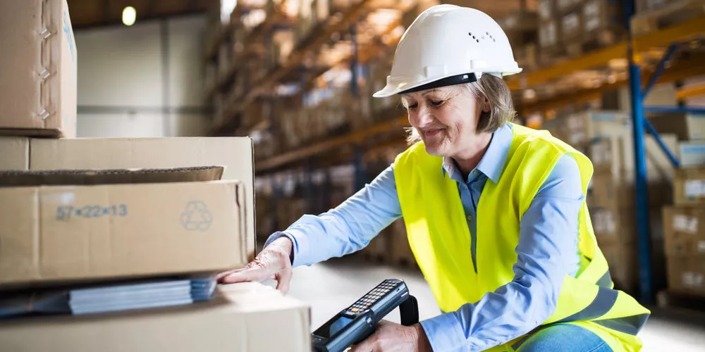 warehouse specialist scanning shipping label for order fulfillment