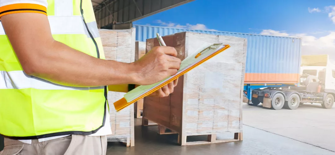 unloading shipping container from semi truck in WSI warehouse