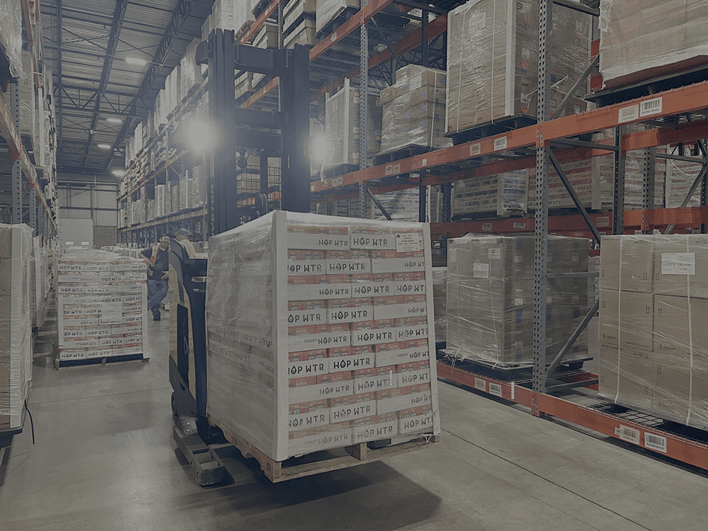 pallet of boxes on forklift in distribution center