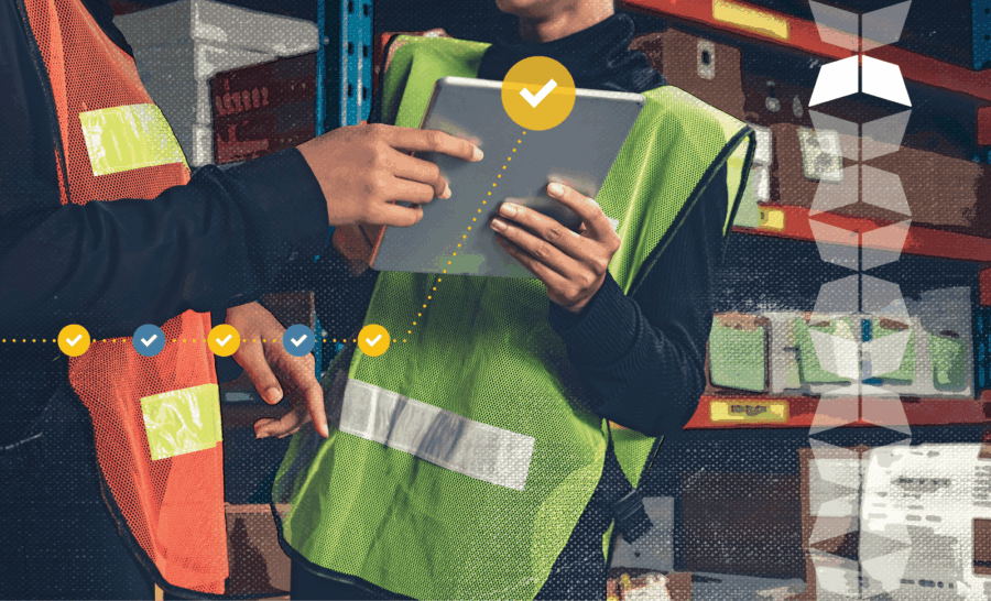 Warehouse workers using tablet for tasks
