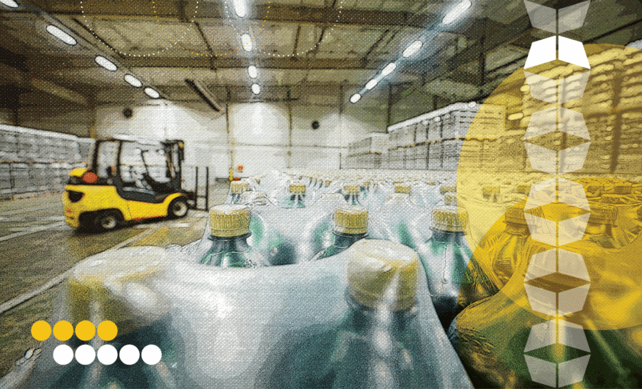Warehouse with packaged bottles, representing downstream logistics and the end-to-end journey from production to distribution.
